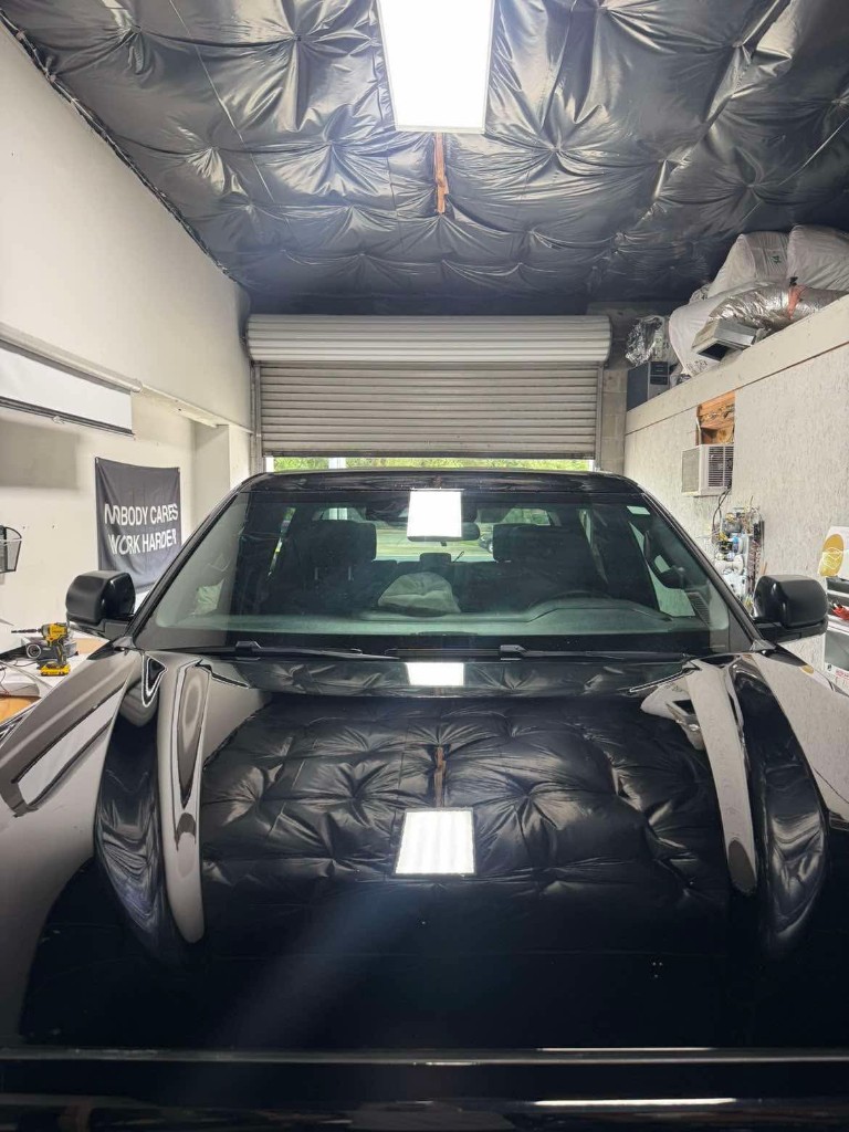Mirror-finish ceramic coating on black truck hood
